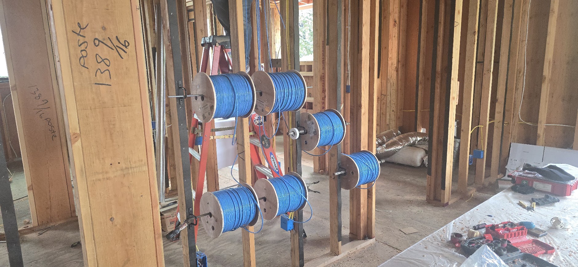 Cable spools staged for pre-wiring