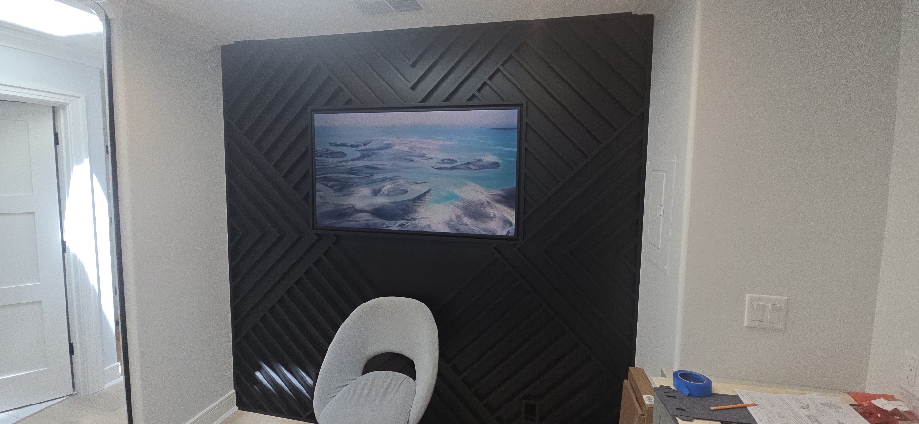 Dark feature-wall TV installation